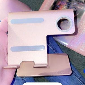 Rose gold iPhone and Apple Watch charging station